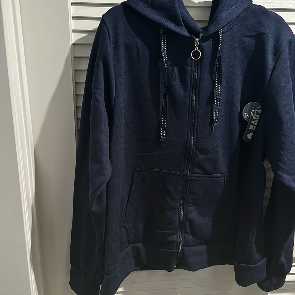RAG Blue Hoodie with Zip down and two front pockets. 100% Polyester.